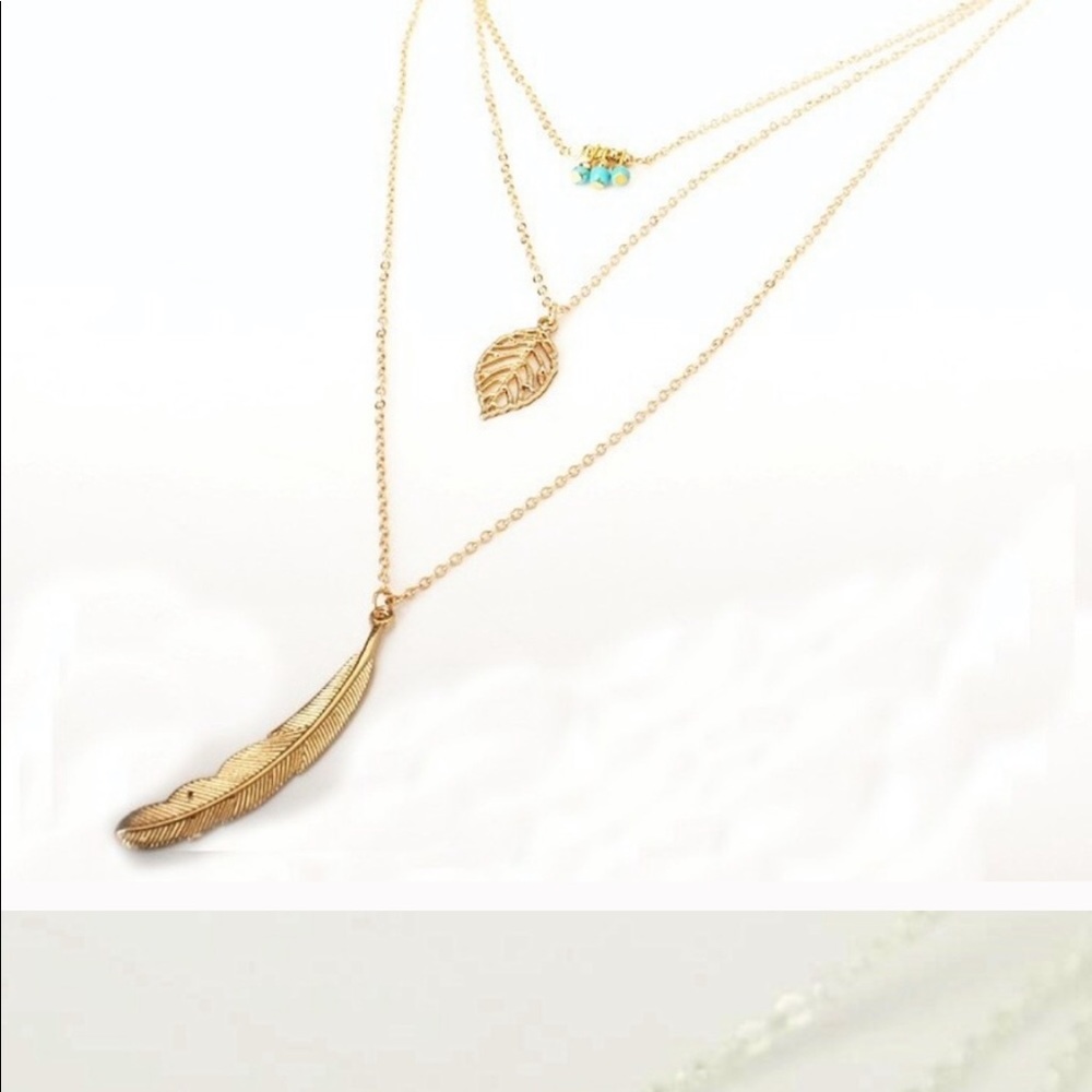 3 tier golden feather statement necklace.